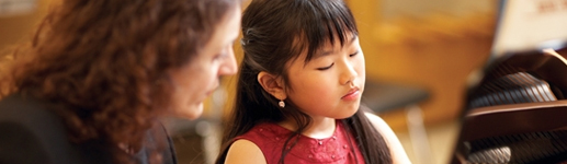 Student performing at a piano examination