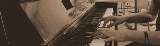 Hands on piano keys at a summer program